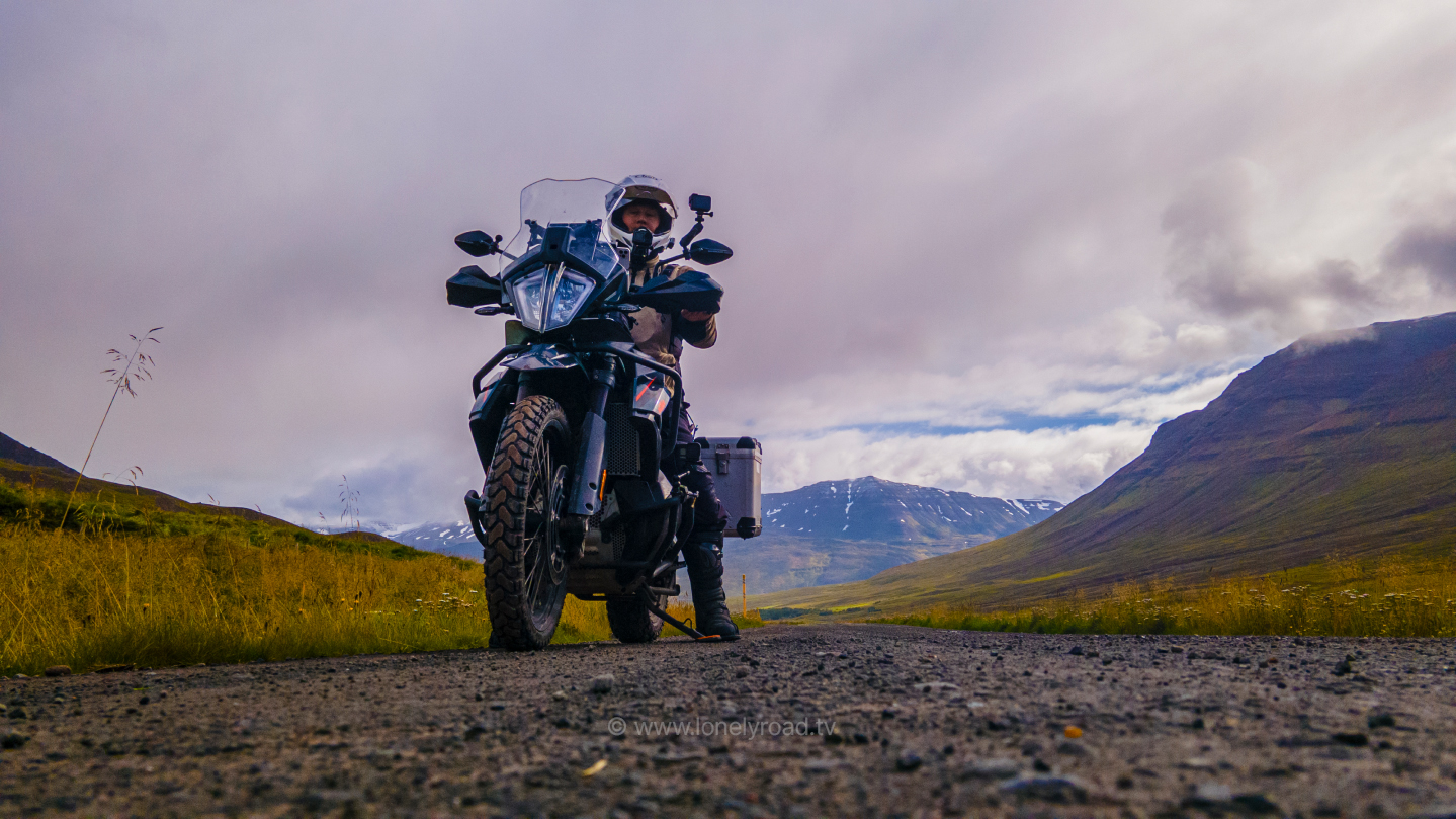 Low angle of man on a KTM 890 Adventure motorcycle